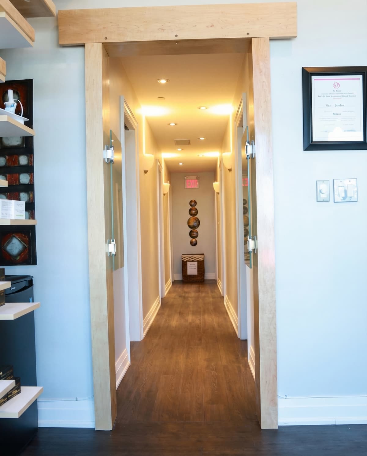 Leslie Med Spa interior hallway — warm lighting, treatment rooms